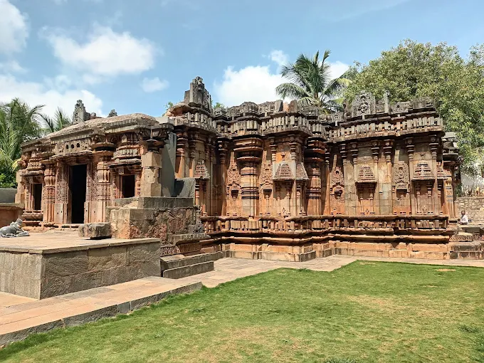 Shri Chandramauleshwara Temple in Hubballi, a carved stone temple with a Nandi figure on a green lawn